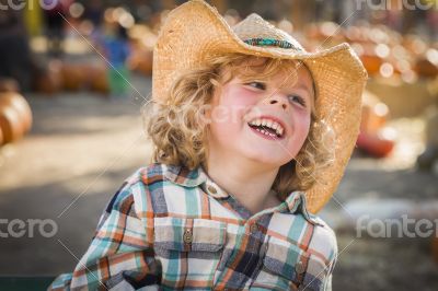 Little Boy in Cowboy Hat at Pumpkin Patch