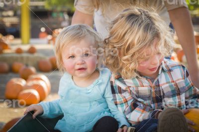 Young Family Enjoys a Day at the Pumpkin Patch