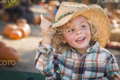 Little Boy in Cowboy Hat at Pumpkin Patch