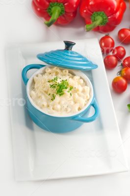 mac and cheese on a blue little clay pot