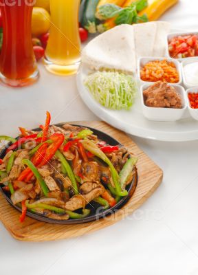 original fajita sizzling hot  on iron plate