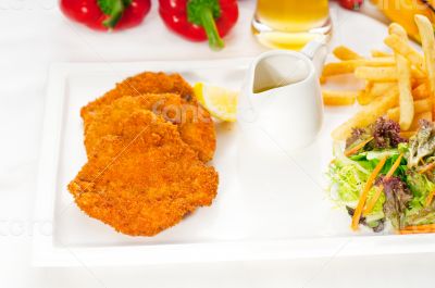 classic Milanese veal cutlets and vegetables