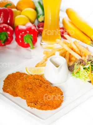 classic Milanese veal cutlets and vegetables