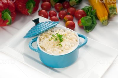 mac and cheese on a blue little clay pot