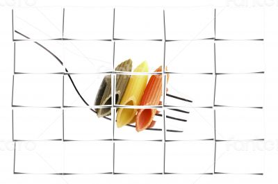 italian penne pasta on a fork