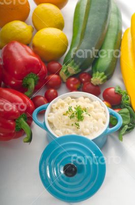 mac and cheese on a blue little clay pot