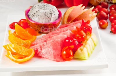 mixed plate of fresh sliced fruits
