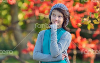 girl thinking in nature on background of autumn