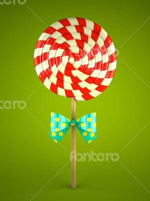 Lollipop with bow on green background