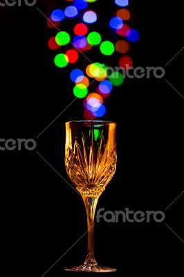 Light bubbles coming out of a wine glass