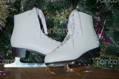 New year`s gift - the beautiful woman skates.