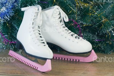 New year`s gift - the beautiful woman skates.