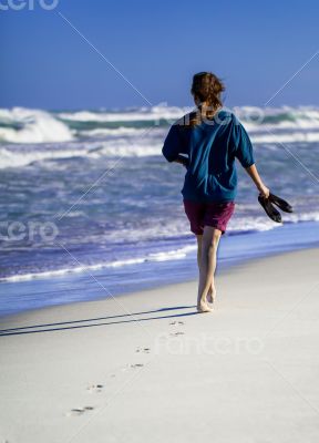 Caribbean Cuba woman goes for a walk on the beach in the Caribbean