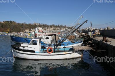 Boats near the jetty boat station on a sunny day.