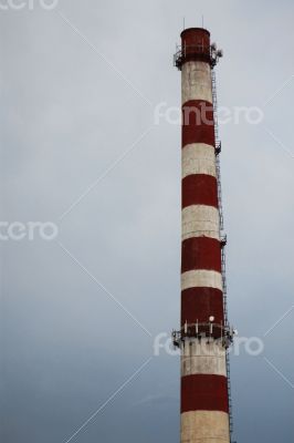 Industrial pipe of factory and summer landscape