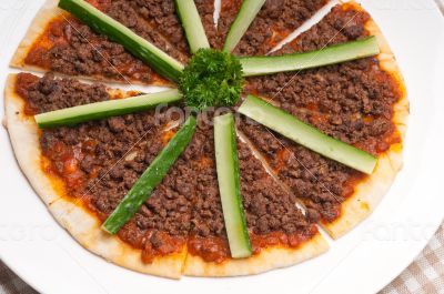 Turkish beef pizza with cucumber on top