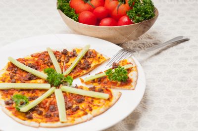 Turkish beef pizza with cucumber on top