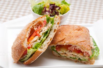 ciabatta panini sandwich with chicken and tomato