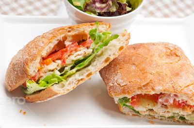 ciabatta panini sandwich with chicken and tomato