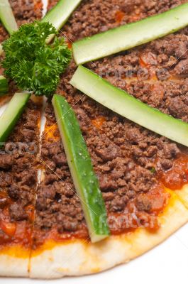 Turkish beef pizza with cucumber on top