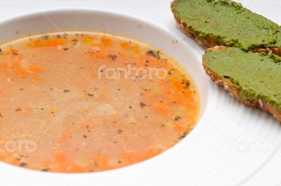 Italian minestrone soup with pesto crostini on side