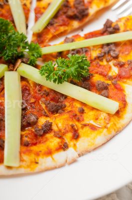Turkish beef pizza with cucumber on top