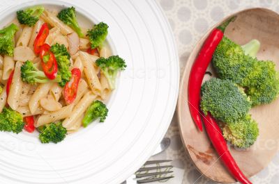 Italian penne pasta with broccoli and chili pepper