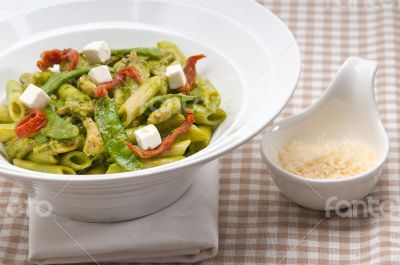 Italian penne pasta with sundried tomato and basil