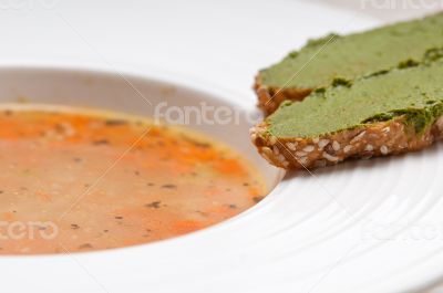 Italian minestrone soup with pesto crostini on side