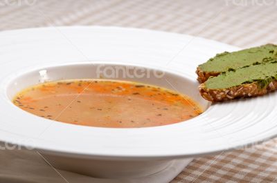 Italian minestrone soup with pesto crostini on side