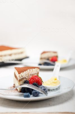 tiramisu dessert with berries and cream