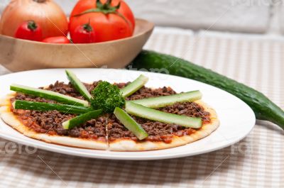 Turkish beef pizza with cucumber on top