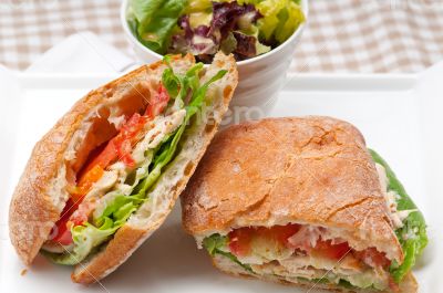 ciabatta panini sandwich with chicken and tomato