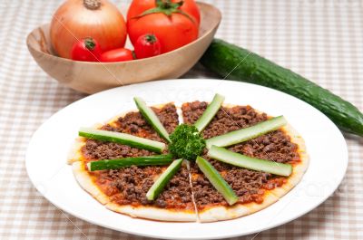 Turkish beef pizza with cucumber on top
