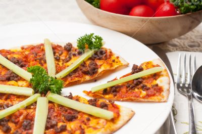 Turkish beef pizza with cucumber on top
