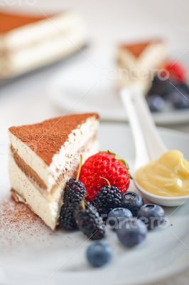 tiramisu dessert with berries and cream