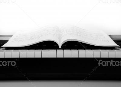 Piano keys and musical book