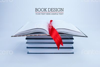 open book on a pile of books