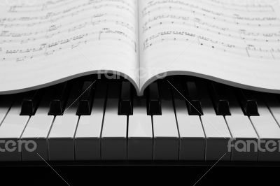 Piano keys and musical book
