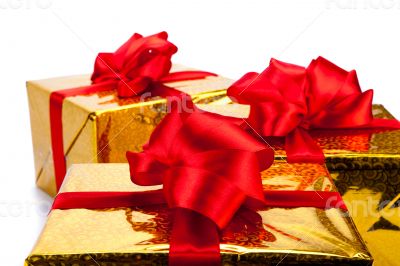 Three gold gift boxes
