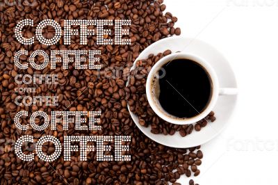 cup of black coffee with roasted beans