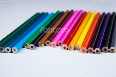 a stack of colored pencils