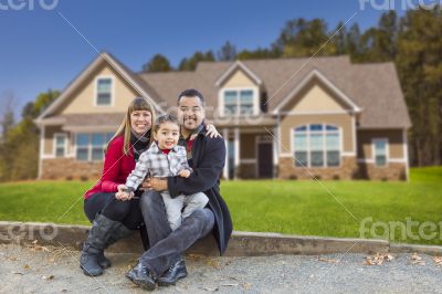 Mixed Race Family in Front of Their New Home