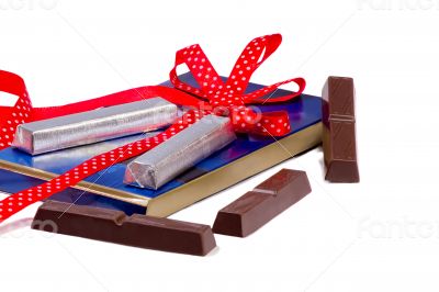 A plate of chocolate in a beautiful package on a white backgroun