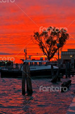 Venice Italy sunset with cruise boat