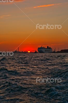 Venice Italy sunset with cruise boat