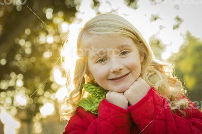 Little Girl Wearing Winter Coat and Scarf at the Park