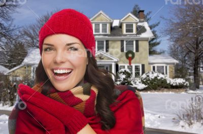 Smiling Mixed Race Woman in Winter Clothing Outside in Snow