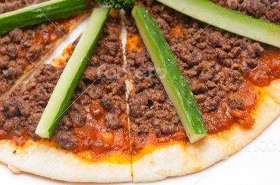 Turkish beef pizza with cucumber on top