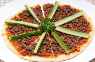 Turkish beef pizza with cucumber on top